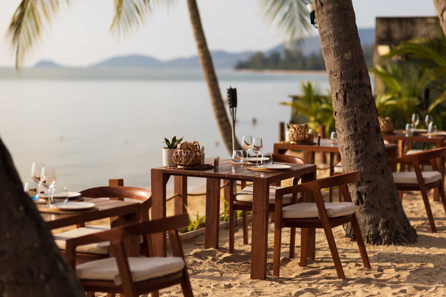 Nikki Beach Koh Samui - beach front dining tables on the sand