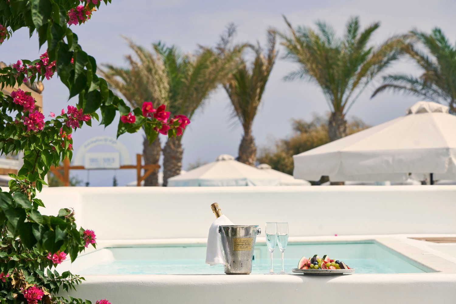 Private Pool area with wine bucket, champagne flutes and a fruit platter