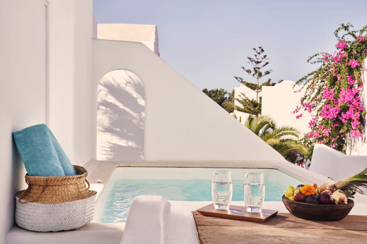 Signature Room with Jetted Tub: pool area with towels and fruit platter